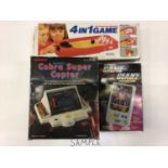 Box of Retro hand held games together with Tandy electronic Cobra Super Copter game and Nintendo Sno