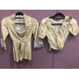 A selection of Victorian cream and black silk jackets and bodices.