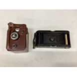 Rolleiflex twin lens reflex camera in case, and a Kodak folding camera