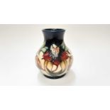 Moorcroft pottery vase decorated in the Anna Lilly pattern, dated 98, 16cm high