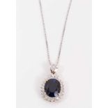 18ct gold synthetic oval blue stone and diamond cluster pendant on 14ct white gold chain