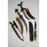 Two late 19th century Sudanese daggers with scabbards and two other daggers (4)