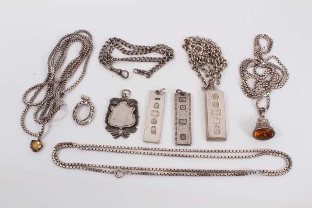 Various silver chains, three silver ingots, other fobs and pendants