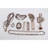 Various silver chains, three silver ingots, other fobs and pendants