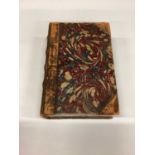 Antique pamphlets box in the form of a book with leather spine and marbled paper covers.