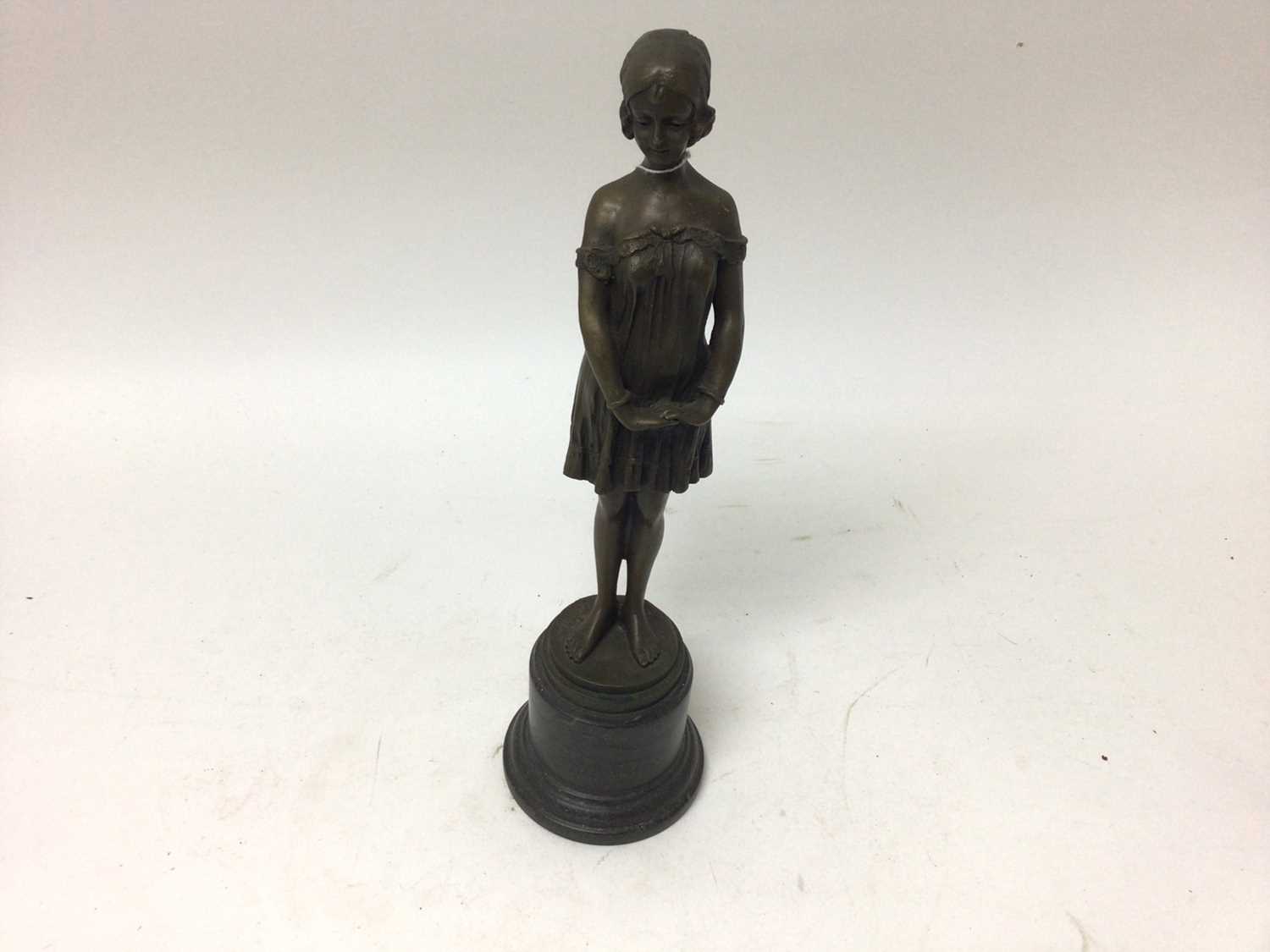 After Demetre Chiparus (1886-1947), bronzed figure of a woman standing on a stone base, signed, 34.5