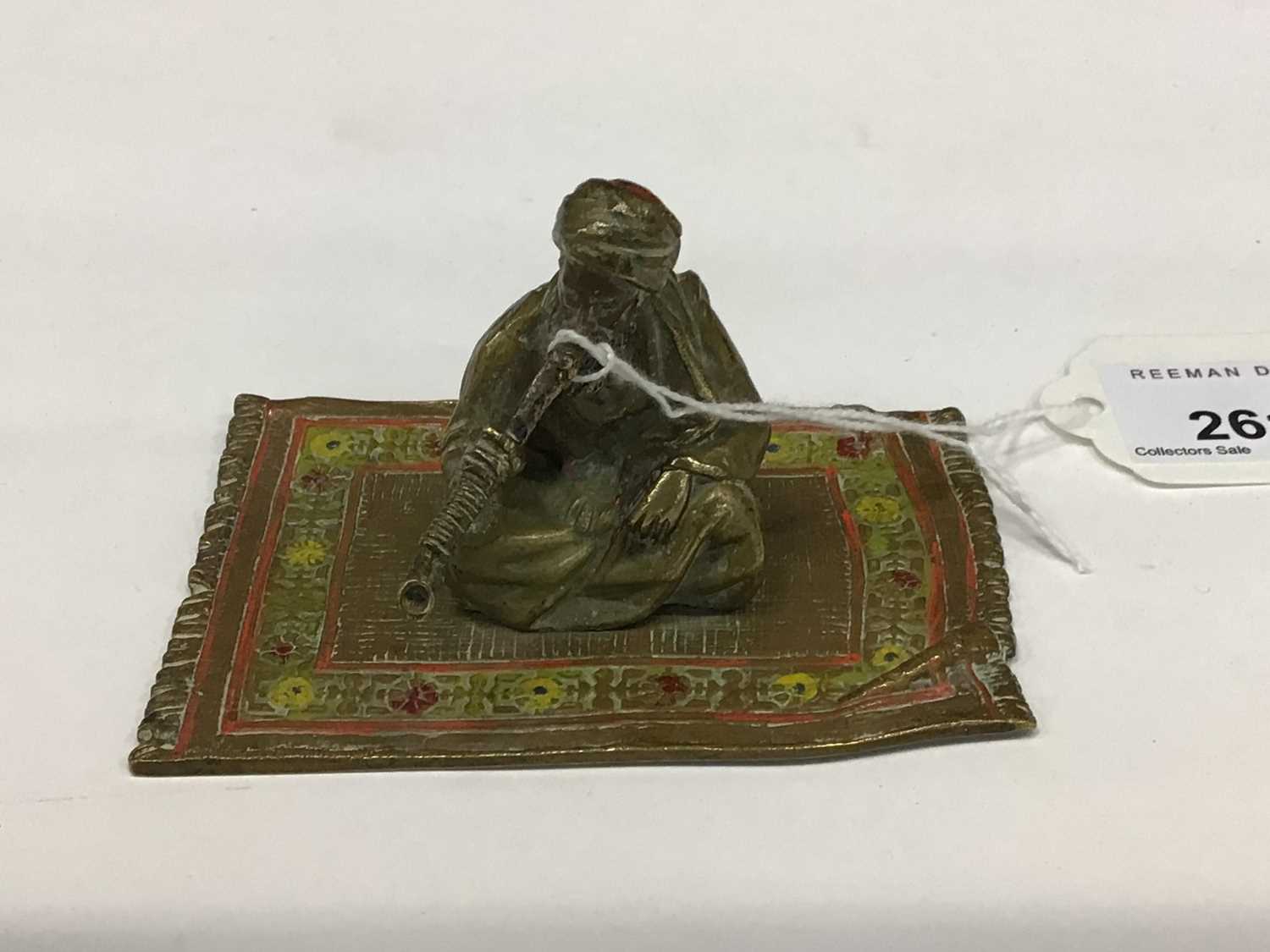 Cold painted bronze figure of an Arab man sitting on a rug smoking, probably Austrian