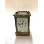 Early 20th century carriage clock with white enamel dial