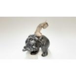 Royal Copenhagen porcelain figure of a fawn on a bears back and another of a bird (2)
