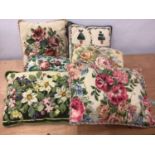 A quantity of contemporary hand stitched and other needle-point tapestry cushions in floral designs.