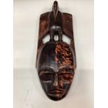 African carved wooden mask, together with a group of African textiles (1 box)