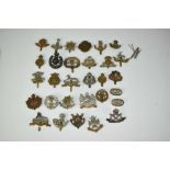 Collection of thirty military cap badges to include Shropshire Yeomanry, Lincolnshire Reigment and L