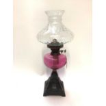 Oil lamp with cranberry reservoir