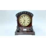Victorian mantle clock in flame mahogany case by Merz, London