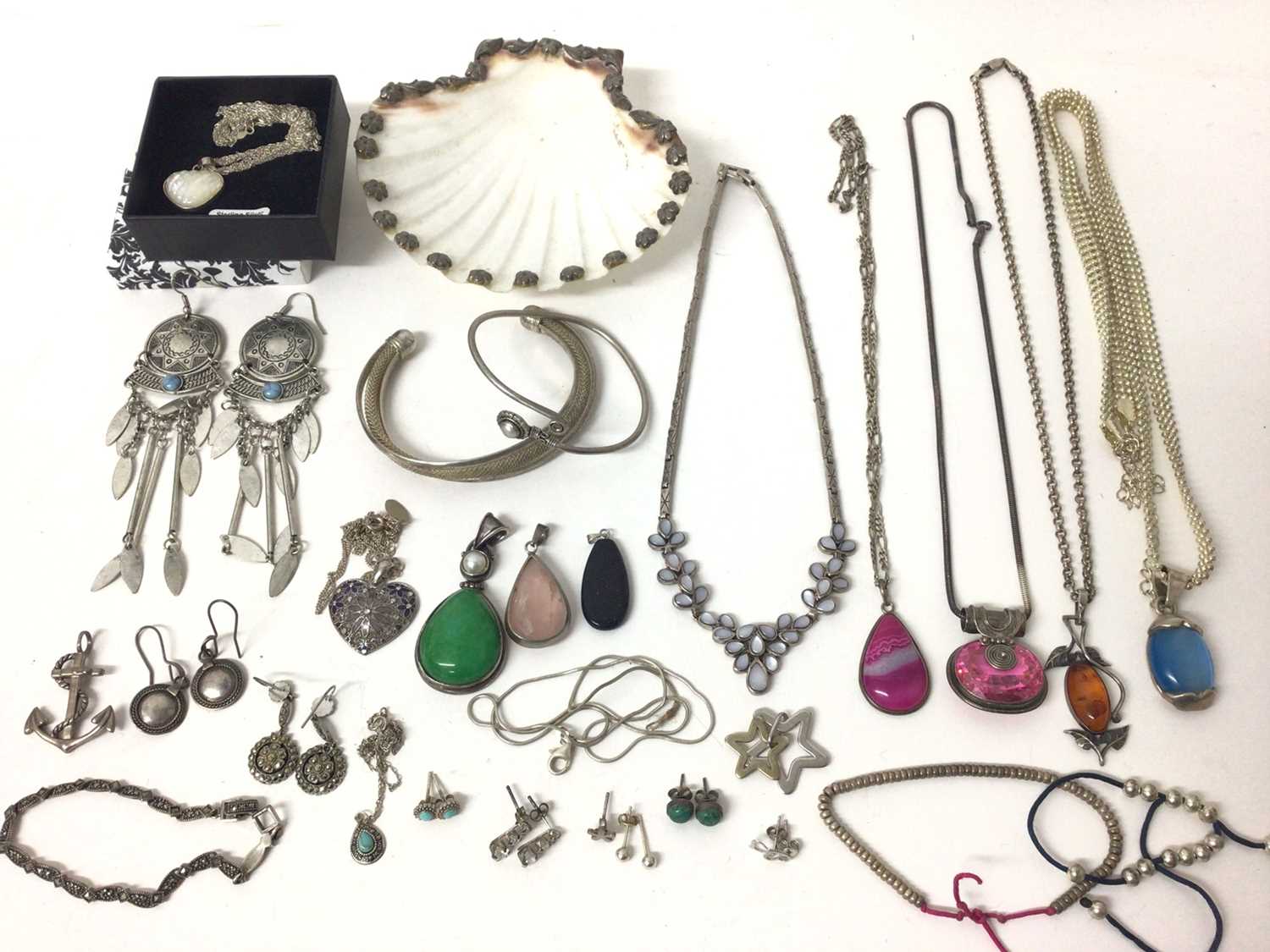 Group of silver mounted semi precious gem stone pendants on chains and other silver/ white metal jew