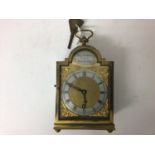 Charles Frodsham mantel clock in brass case with original key, together with another smaller example