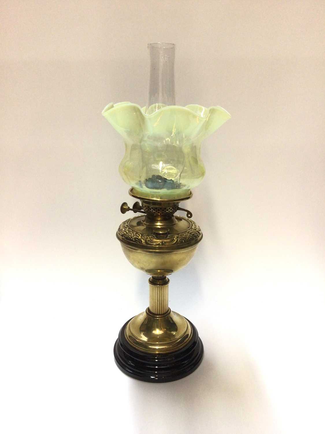 Victorian brass oil lamp with Vaseline glass shade and two further shades