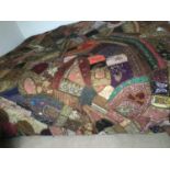 Vintage Indian patchwork bed cover with lavish embroidery and beadwork.