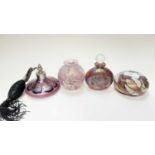 Isle of Wight iridescent scent bottle, paperweight and vase, all with original labels, together with