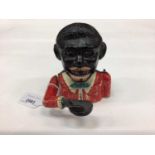 Early 20th century cast iron mechanical money bank “Gentleman in a red jacket and yellow bow tie” wi