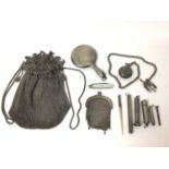 Two white metal mesh purses, silver sovereign case on silver watch chain, silver propelling pencils,