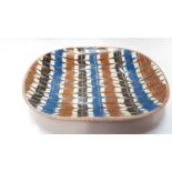 Unusual Poole earthenware slipware dish with geometric decoration, 37cm x 29cm