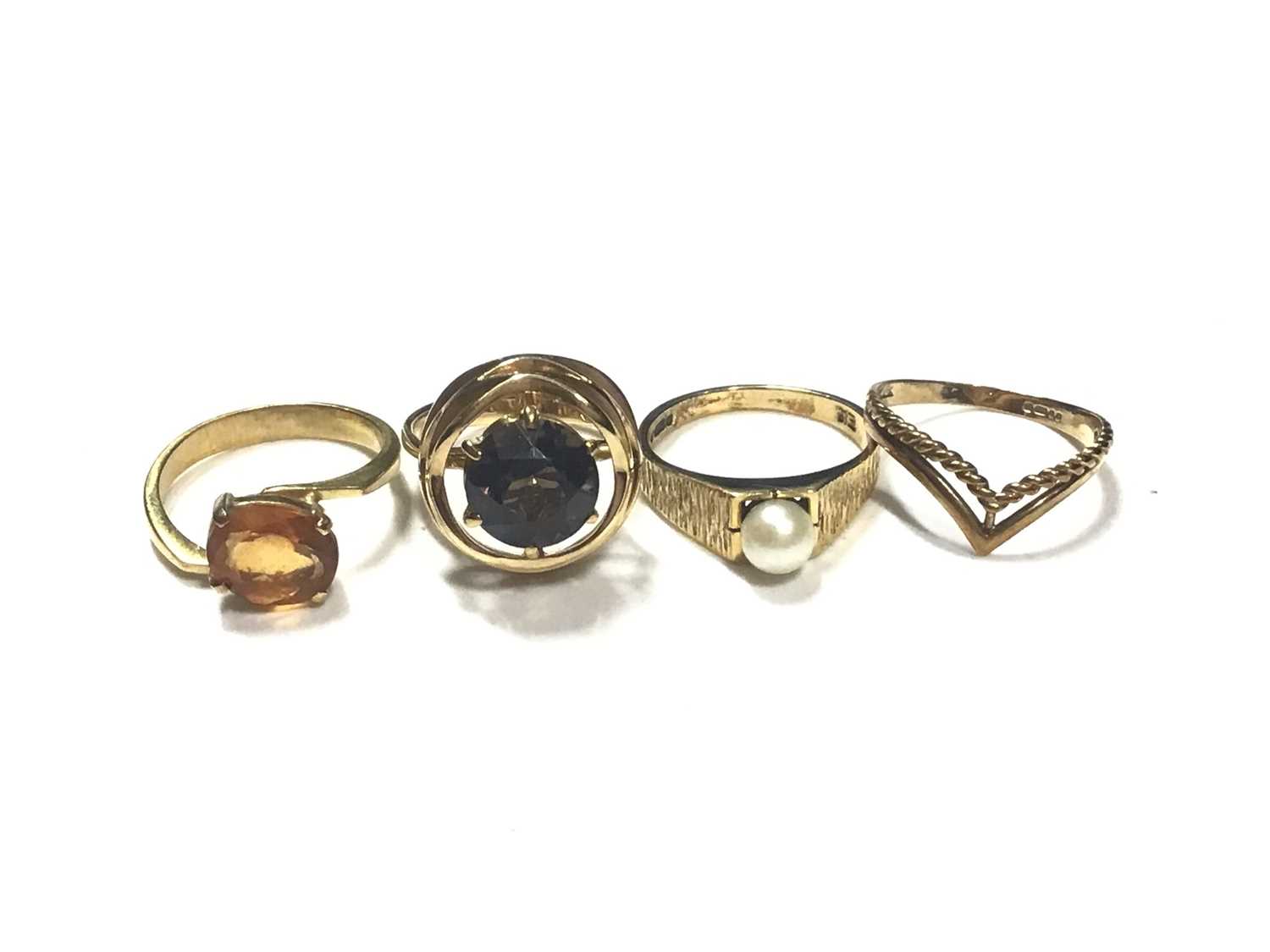 Two 18ct gold gem set dress rings, 9ct gold cultured pearl ring and 9ct gold wishbone ring (4)