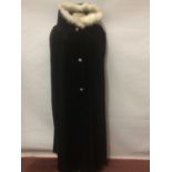 Black corduroy opera cloak with three fancy buttons and a hood. Black velvet fitted evening jacket