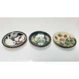 Three Moorcroft coasters/pin dishes to include Lamia pattern signed by Rachel Bishop and Hepatica pa