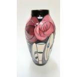 Moorcroft pottery vase decorated with pink and red flowers, dated 2014, 21cm high