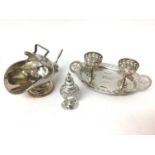 Sterling silver caster, relief-decorated in the rococo style, together with a plated egg cruet and a