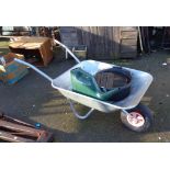 A galvanised wheelbarrow - sold with a watering can, plastic bucket and kneeling pad