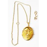 A damaged yellow metal seed pearl set oval locket