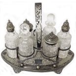A Victorian silver plated seven bottle cruet stand with original plated topped and glass stoppered