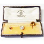 A Mappin and Webb stud case containing a pair of OP 9ct. gold studs and an 18ct. gold plated stud