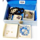 A jewellery box containing a small quantity of assorted costume jewellery
