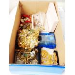 A shoe box containing a small quantity of costume jewellery and jewellery making items, etc.