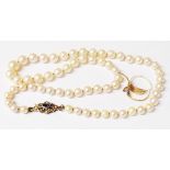 A vintage single string cultured pearl necklace with blue stone and seed pearl set 9ct. gold clasp -