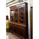 A 1.65m early 20th Century mahogany and strung two part book cabinet with adjustable shelves