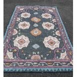 A modern Indian handmade rug by Anthropologie with decoration woven piping in geometric designs -