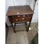 A 50cm late 1920's stained oak two drawer canteen containing a twelve place setting of silver plated