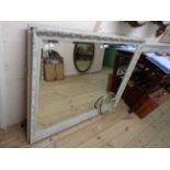 A modern painted wood framed bevelled oblong wall mirror - 1.3m X 1.05m
