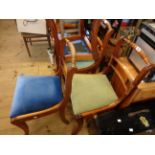 A set of four reproduction mahogany rope back dining chairs with upholstered drop-in seats in two