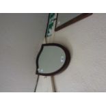 A shield shaped wall mirror - from a dressing table