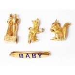 A hallmarked 9ct. gold charm in the form of a bridal couple, two other 9ct. gold charms and a marked