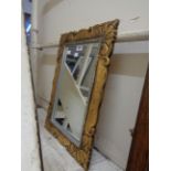 A giltwood style framed oblong wall mirror