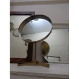 A Durleston Designs Ltd. brassed metal shaving mirror with circular plate and tripod base