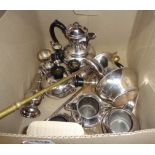 A quantity of silver plated items including two hot water jugs, small trophy cups and two brass fire