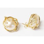 A pair of hallmarked 585 gold Mabe pearl stud ear-rings with diamond set detailing - boxed