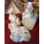 A Lladro figurine of a dog in a basket - sold with two further Nao figurines of a dog and a cat